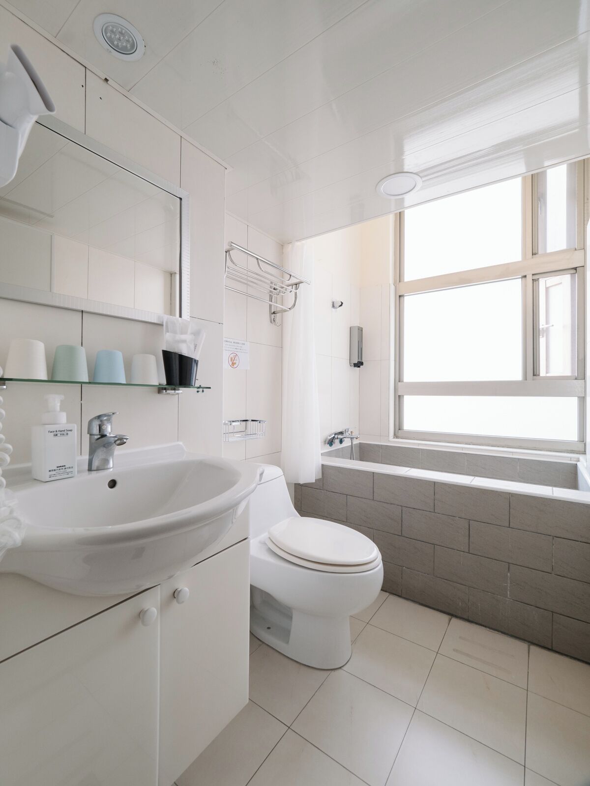 shower, hair dryer, slippers, towels