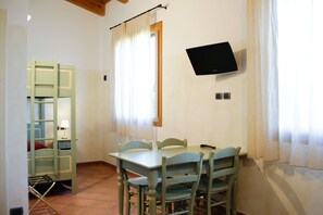 Deluxe Apartment, 1 Bedroom, Kitchenette | Living area | 32-inch flat-screen TV with digital channels, TV - Due Ponti Village (Cesenatico)