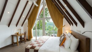 A bedroom with a large bed, wooden headboard, and a view of the outdoors through a large window. - Orchid Villa Kandy (Kandy)