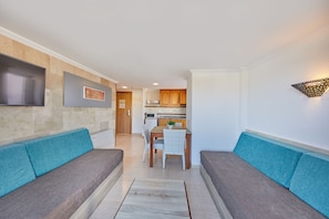 Premium Apartment, 1 Bedroom, Balcony, Sea View | Living area | Flat-screen TV
