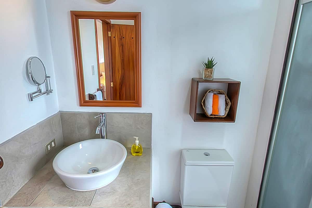 shower, rainfall showerhead, hair dryer, towels