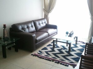 Apartment, 2 Bedrooms, Beach View | Living area | Flat-screen TV