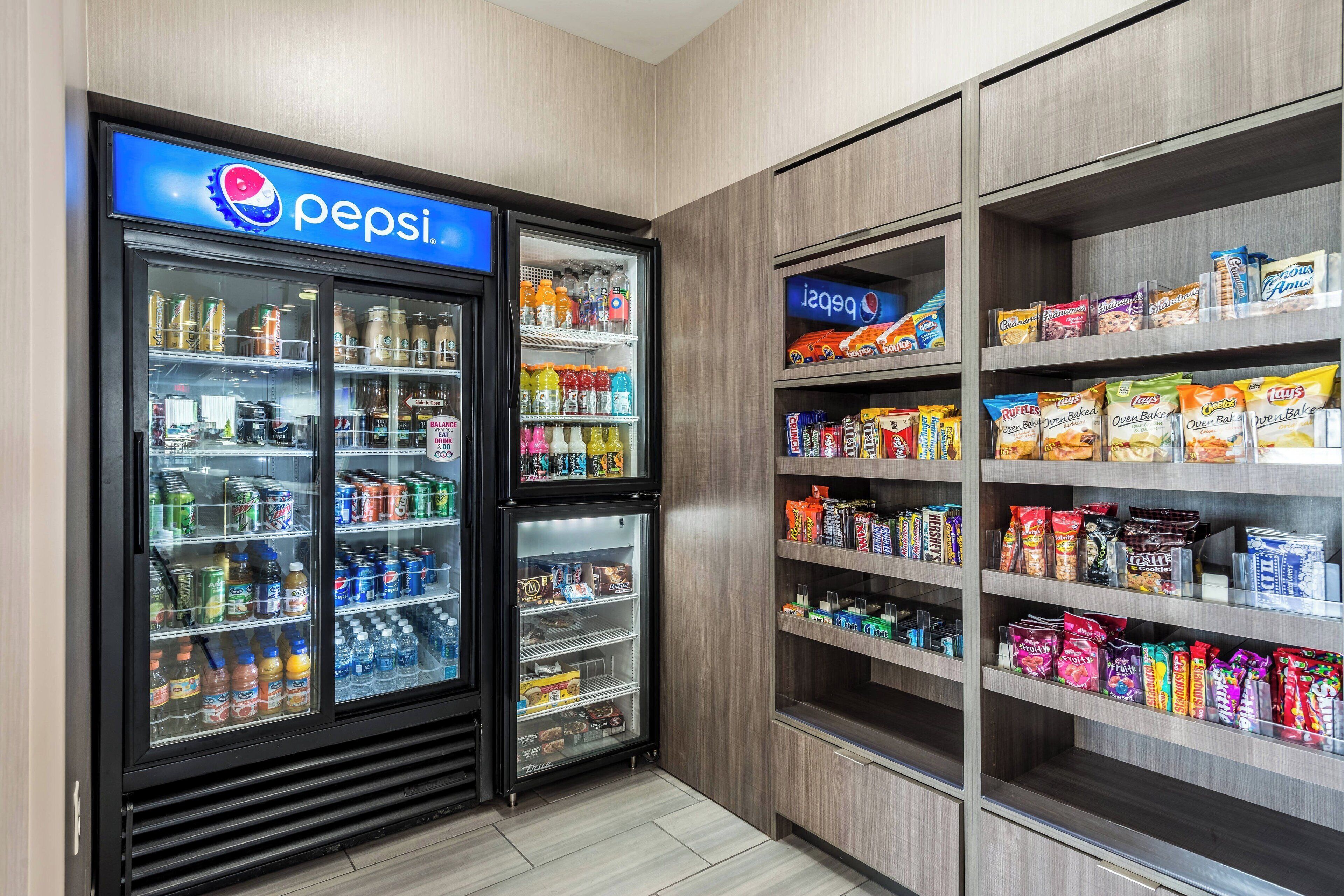 A vending machine area with Pepsi and other snacks.