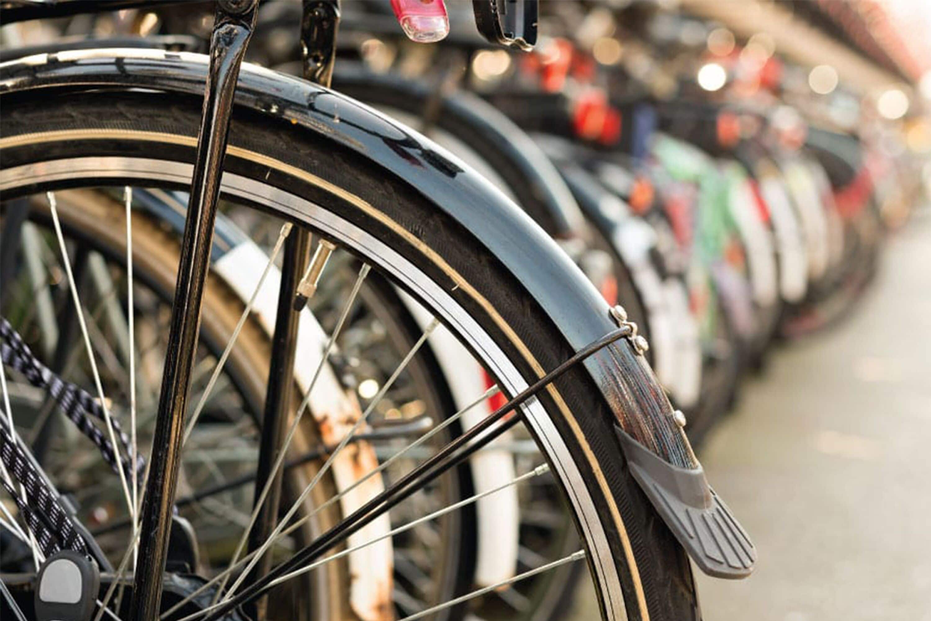 A row of bicycles parked closely together.