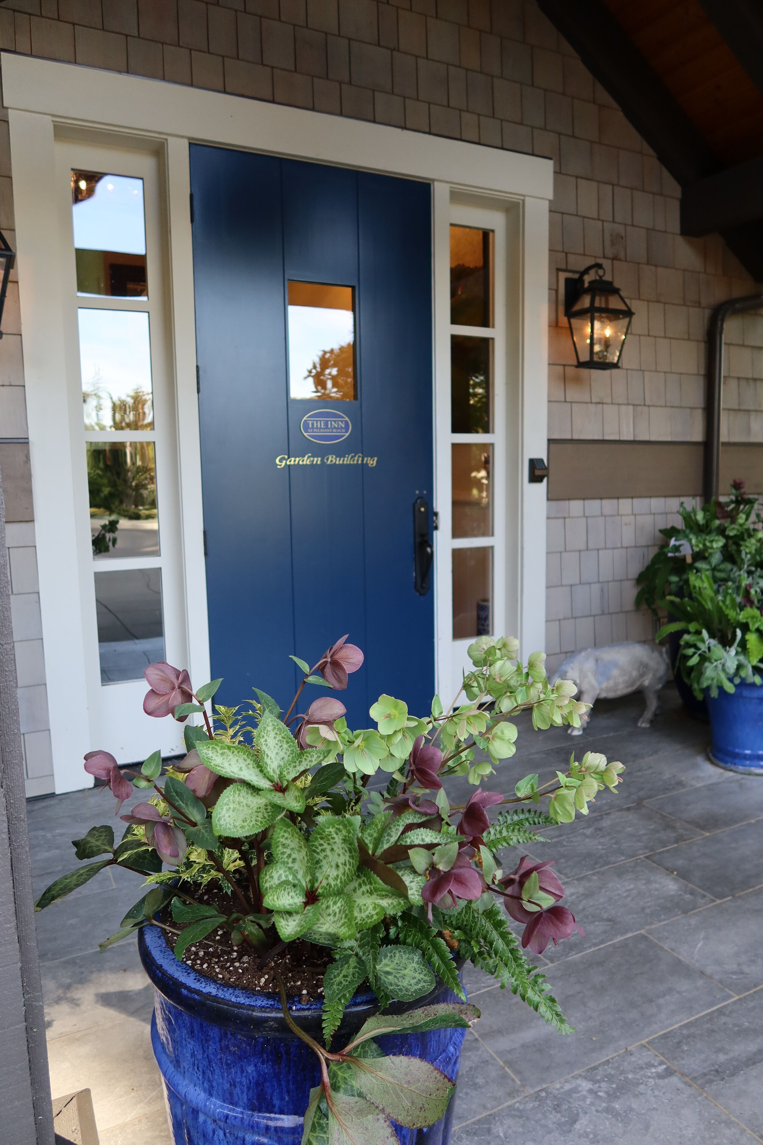 A blue door with a sign reading "The Inn Garden Building."
