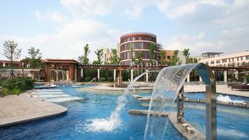 Experience the unique architecture and tranquil pool area with a waterfall feature.