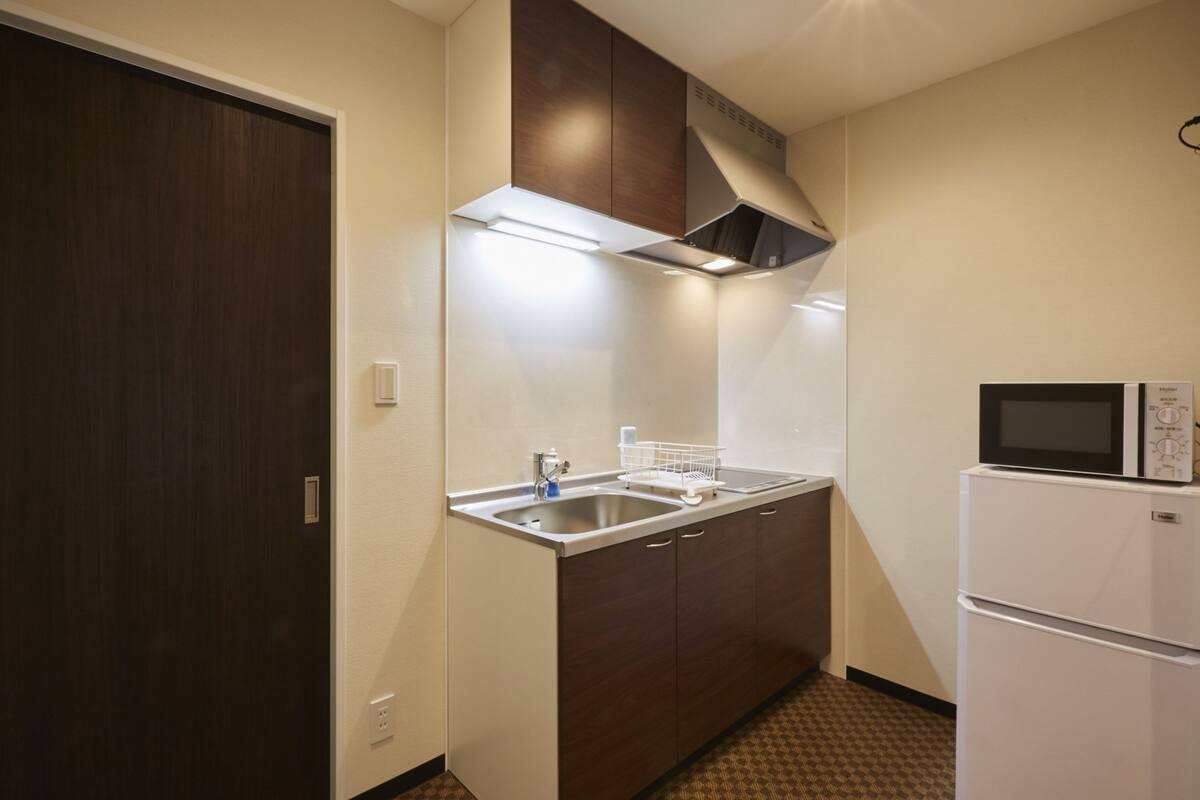 Fridge, microwave, electric kettle, cookware/dishes/utensils