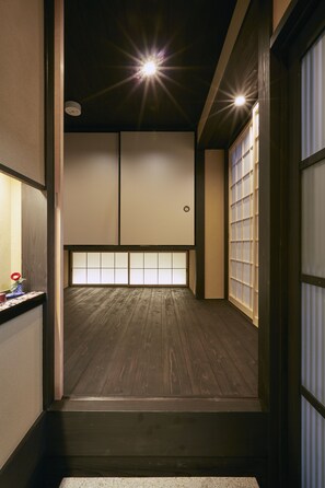 Experience serene tranquility in this traditional Japanese-style room with tatami mat floor and sliding shoji screens.