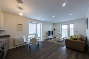 Apartment, 2 Bedrooms | Living area | Flat-screen TV, DVD player, iPod dock
