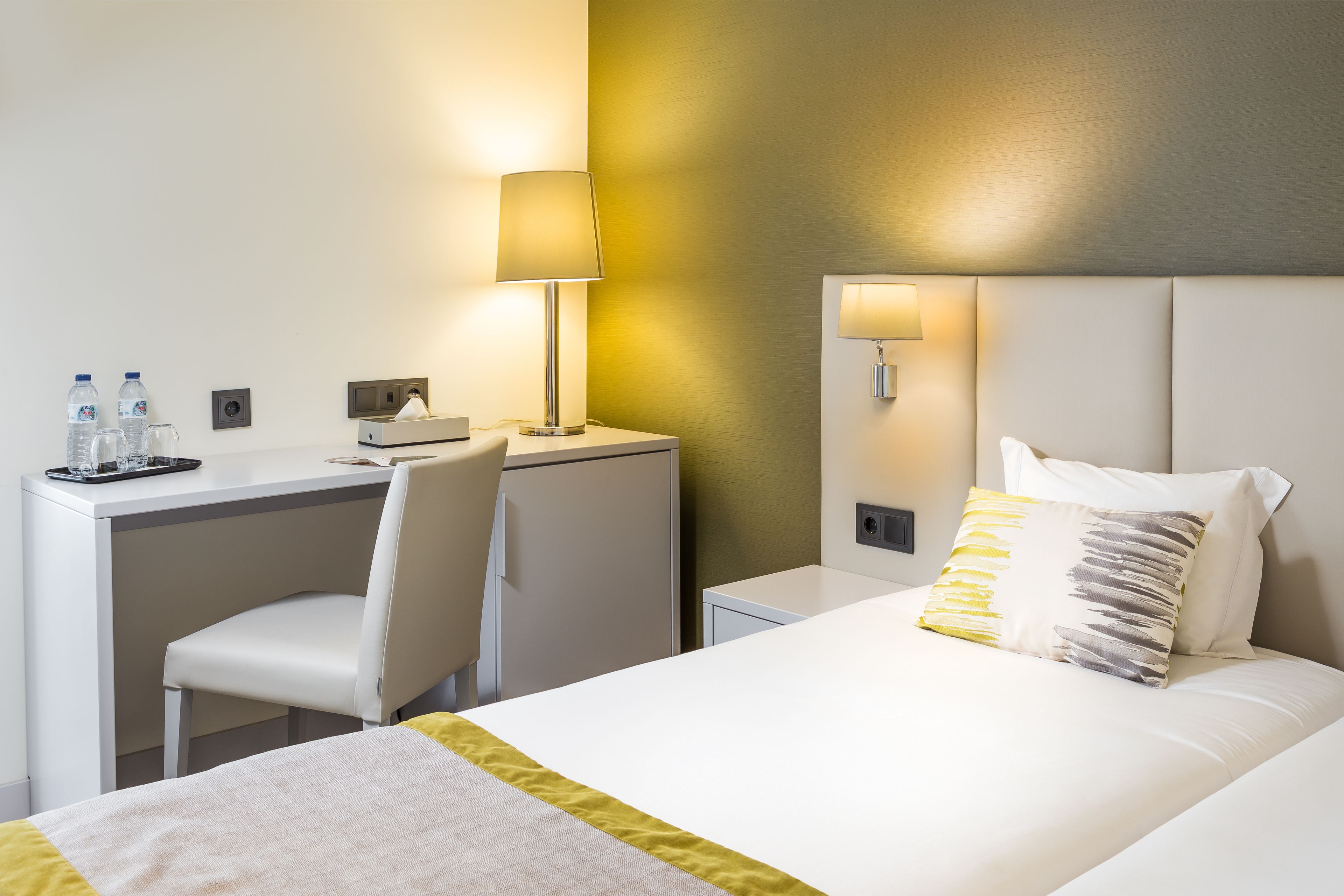 standard twin room | in-room safe, individually decorated, desk, blackout curtains