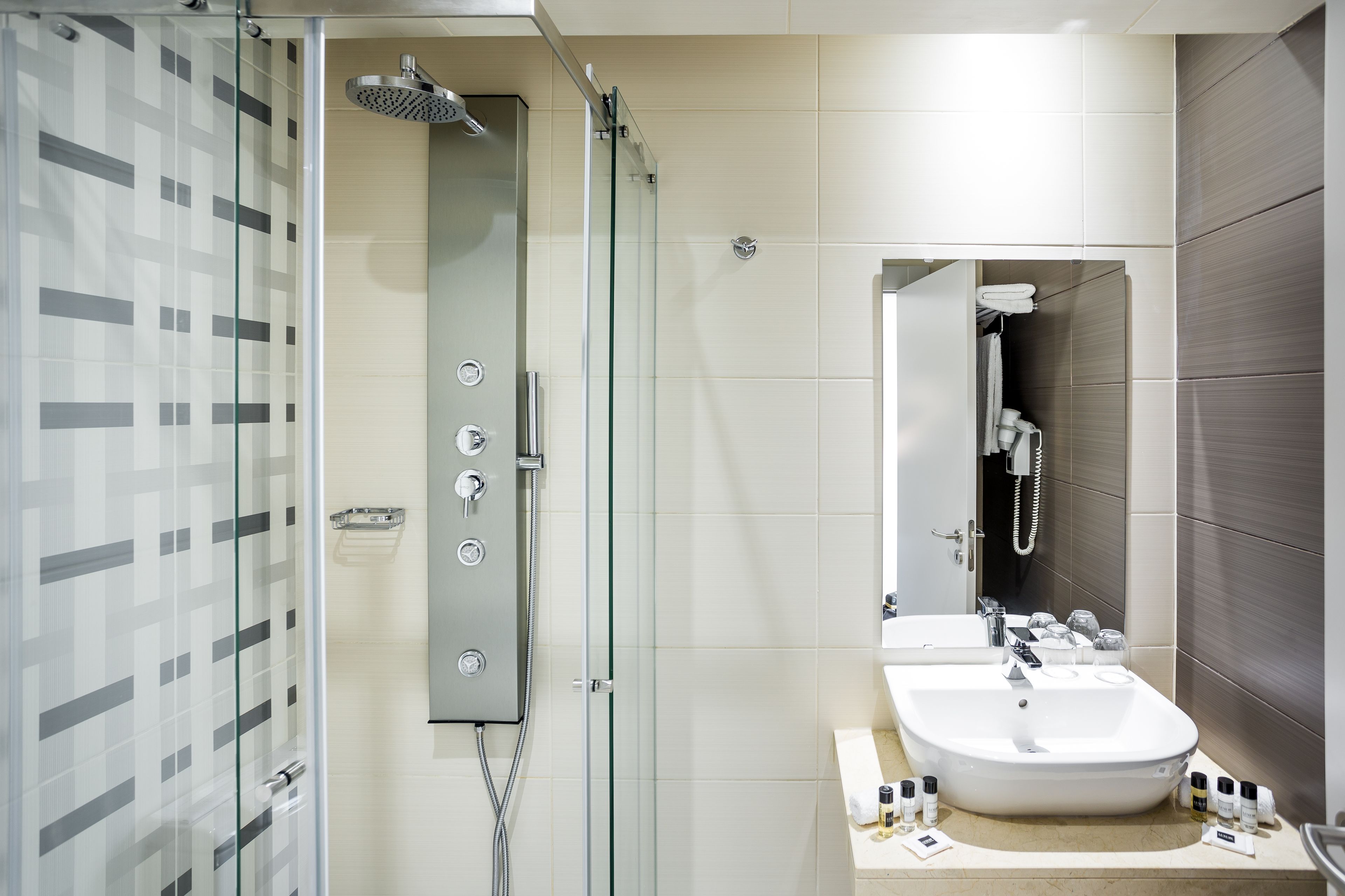 shower, free toiletries, hair dryer, towels