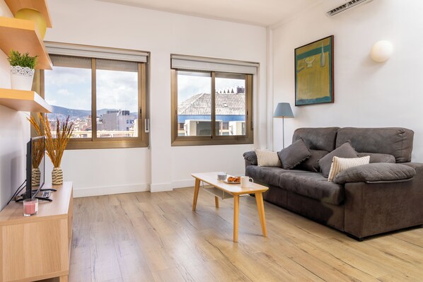 Superior Apartment | Living area | Flat-screen TV