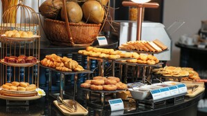 A buffet with various pastries and breads. - Silk River Hoi An Retreat (Da Nang)