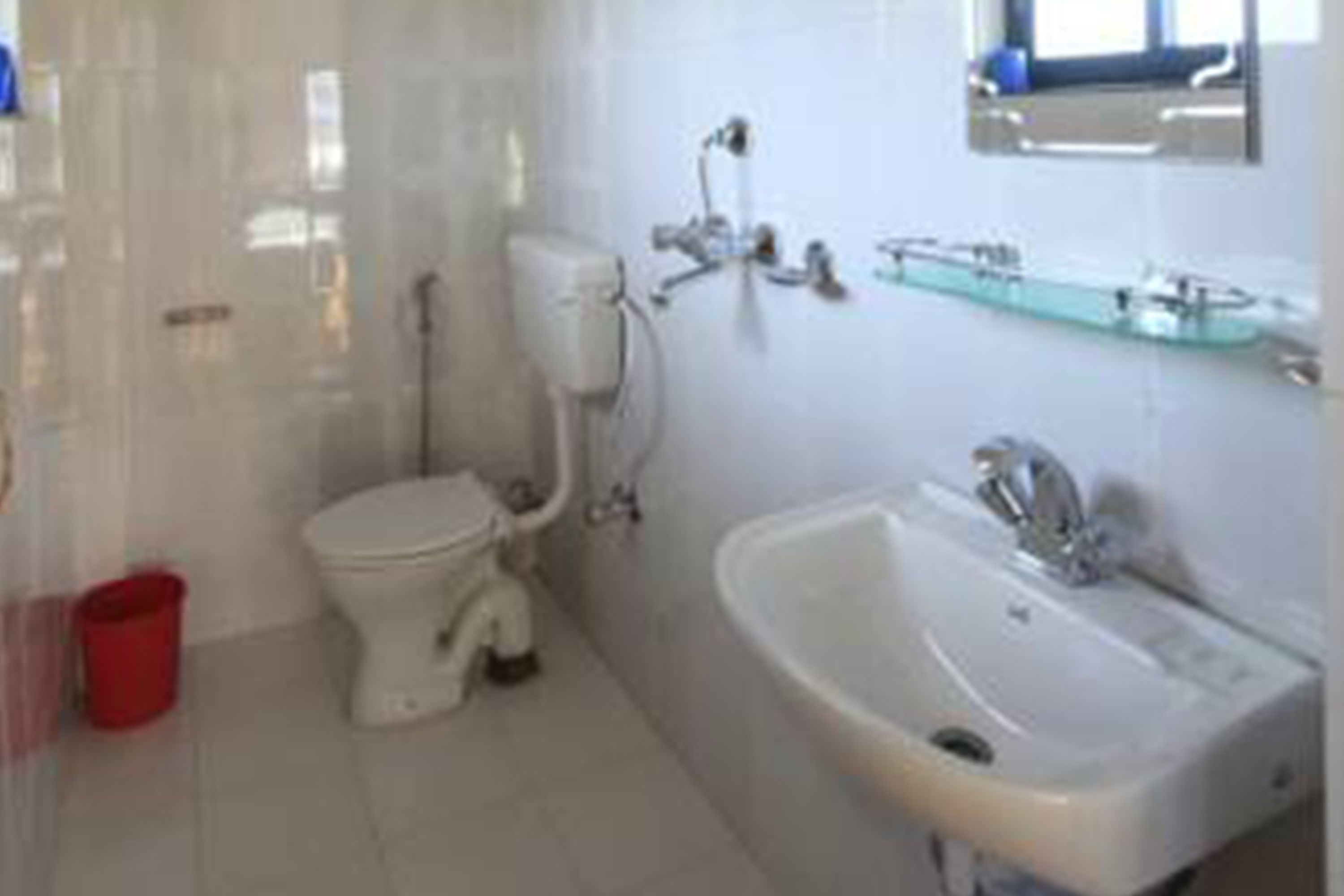 Shower, designer toiletries, hair dryer, slippers