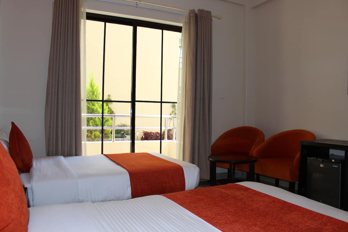 Family Room | Minibar, soundproofing, iron/ironing board (on request), free WiFi