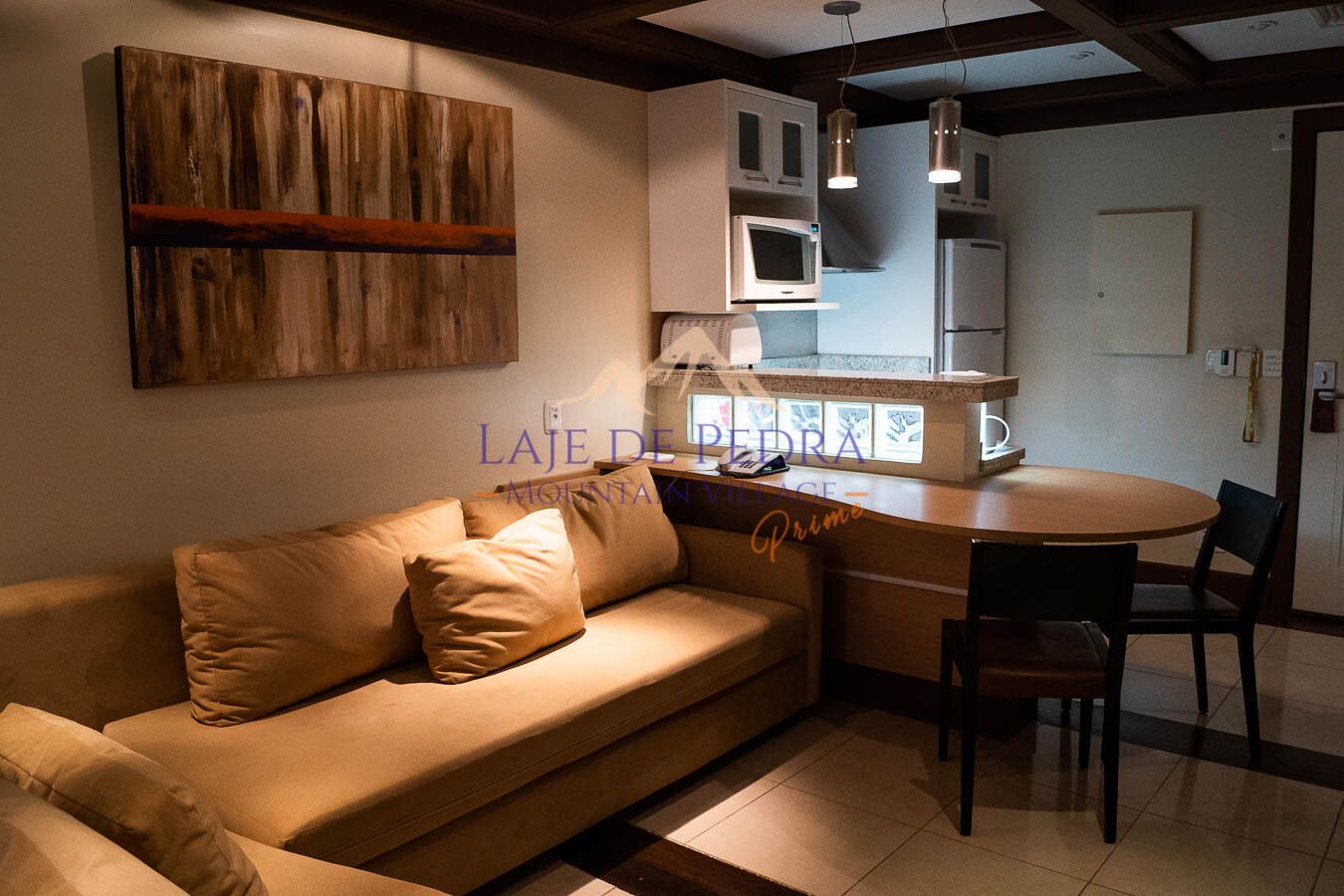 studio premium prime | living area | flat-screen tv, fireplace