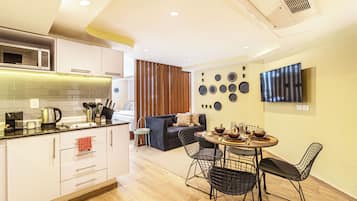 Standard Apartment, 2 Double Beds | Living area | Flat-screen TV, iPod dock