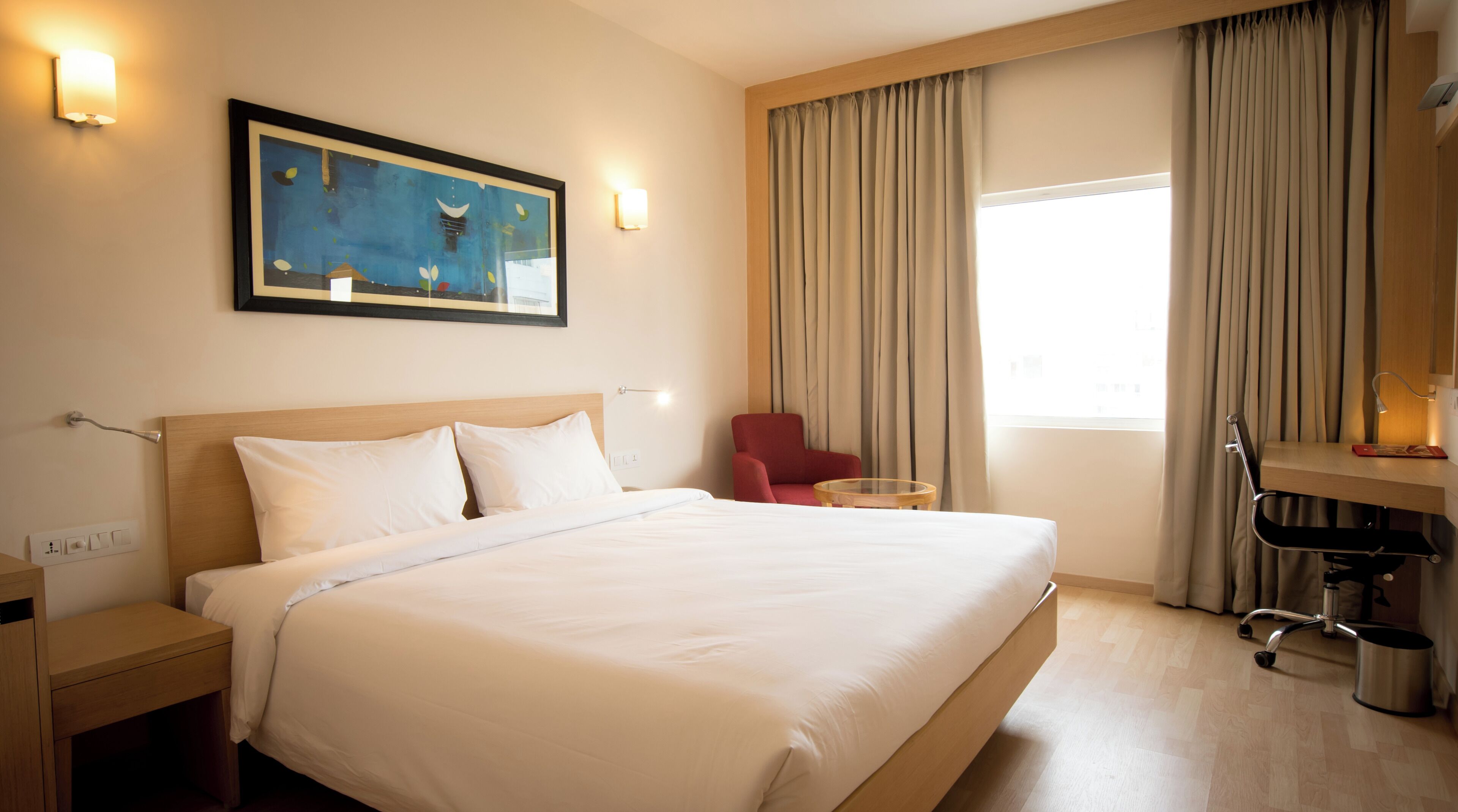 Standard Double Room | Minibar, in-room safe, desk, blackout curtains