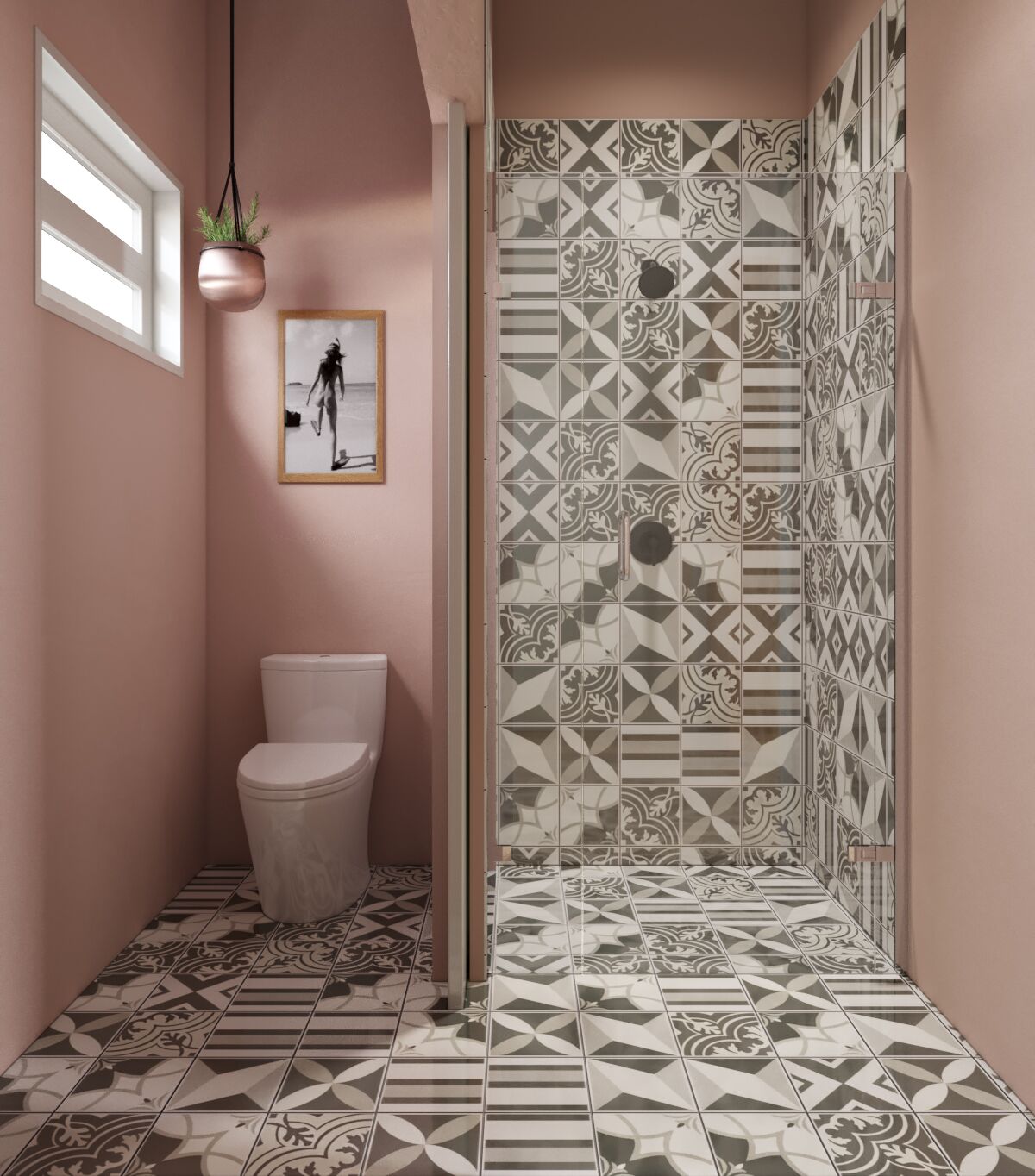 Casa de banho com sanita, planta pendente e azulejos estampados.