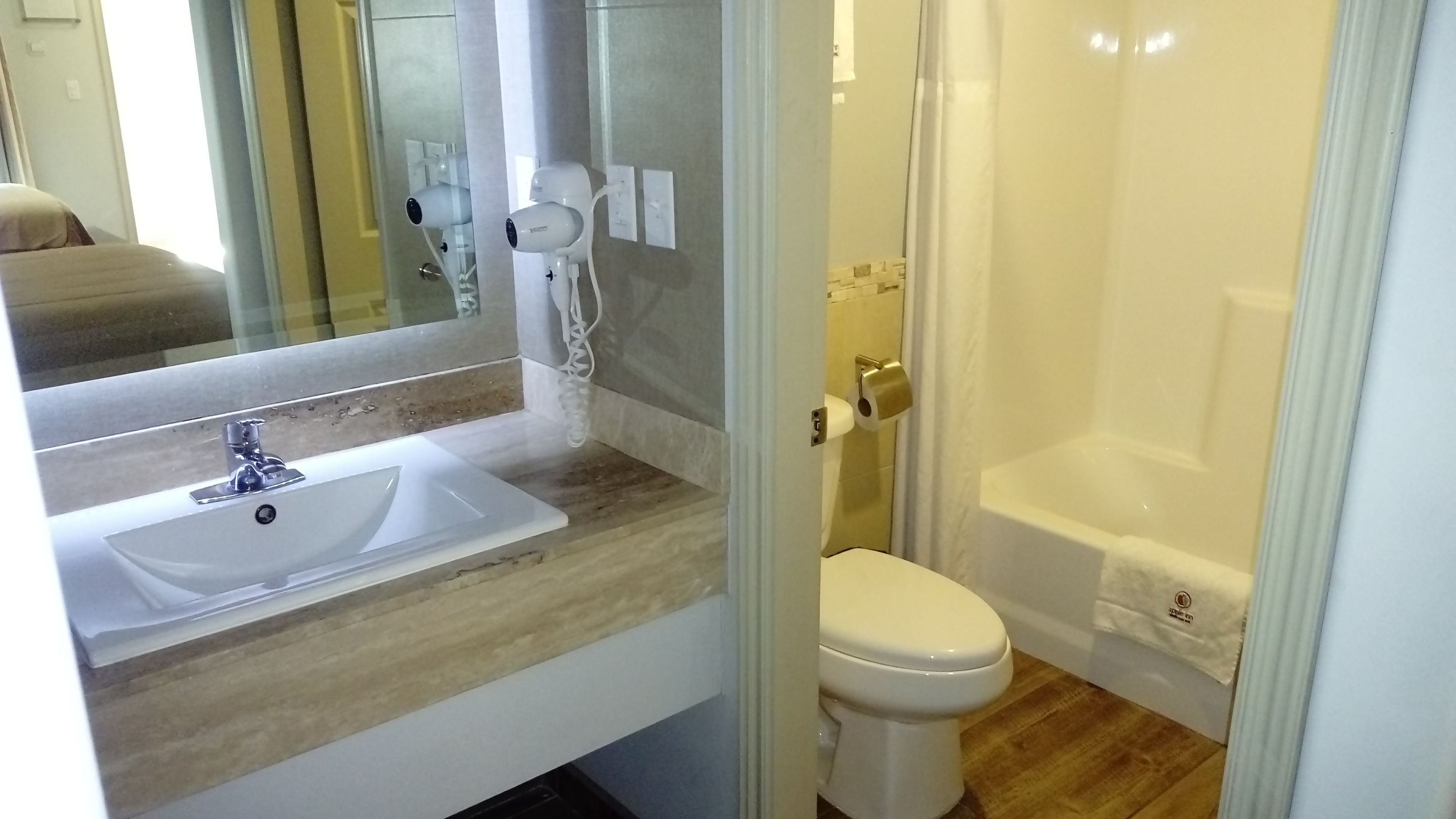 combined shower/bathtub, free toiletries, hair dryer, towels