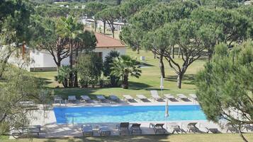 A heated pool, pool loungers