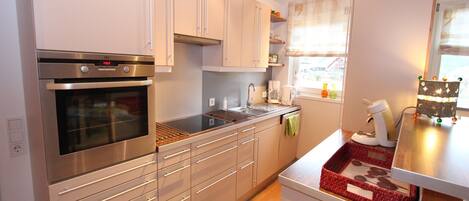 Fridge, oven, dishwasher, high chair