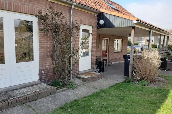 Stroll through the garden to the entrance of this charming home.