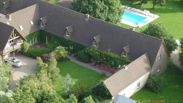 An aerial view of a residential property with a swimming pool, multiple houses, and a well-maintained lawn. - Holiday Home in Quend-Plage near Forest (Quend-Plage)