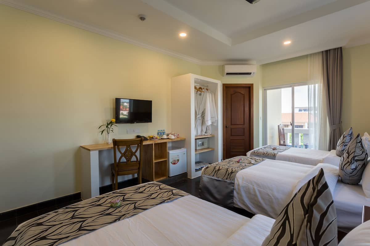 Deluxe Triple City View Balcony | Premium bedding, minibar, in-room safe, desk