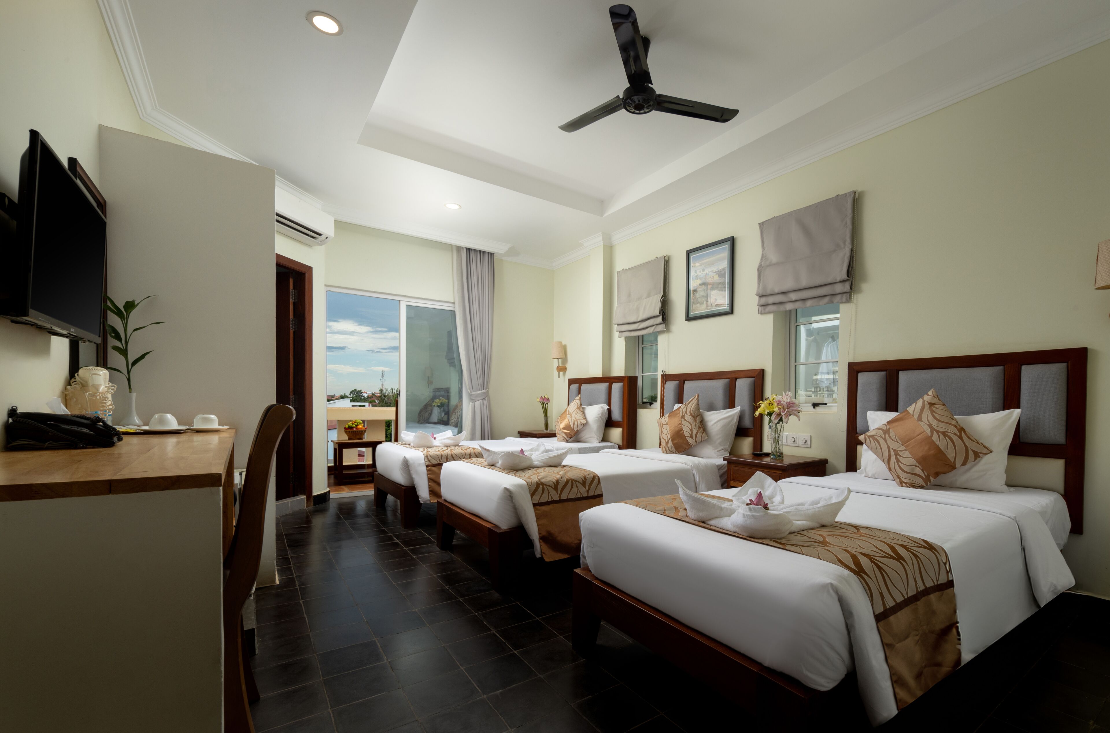 Deluxe Triple City View Balcony | Premium bedding, minibar, in-room safe, desk