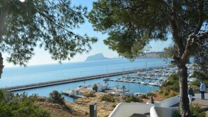 A coastal walkway with a marina in the background. - Sunny Coastal Stay in Zingst (Moraira)