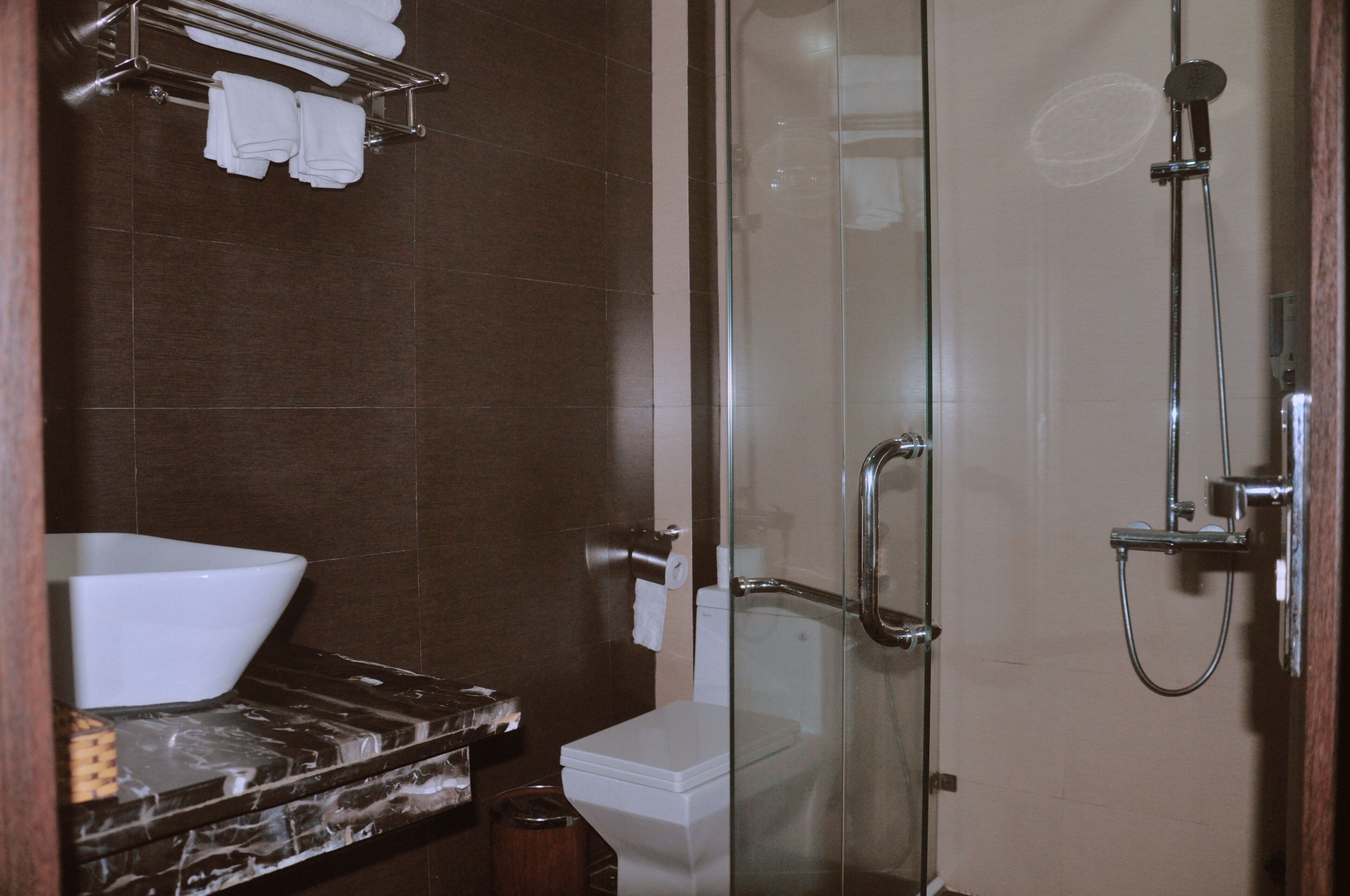 shower, designer toiletries, hair dryer, slippers