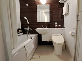 Combined shower/tub, free toiletries, hair dryer, slippers