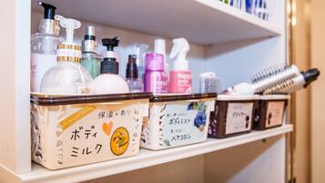 A shelf with various personal care products, including bottles and containers.