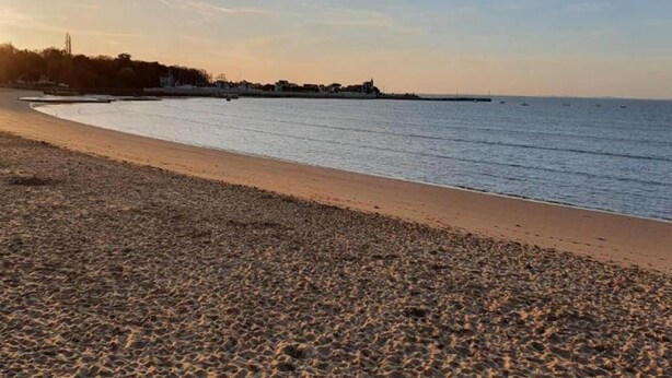 A pebbled beach with a calm sea and a distant shoreline. - Apartment in France with Ocean Views (Fouras)