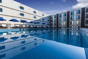 Seasonal outdoor pool, open 3:00 PM to 10:00 PM, pool loungers