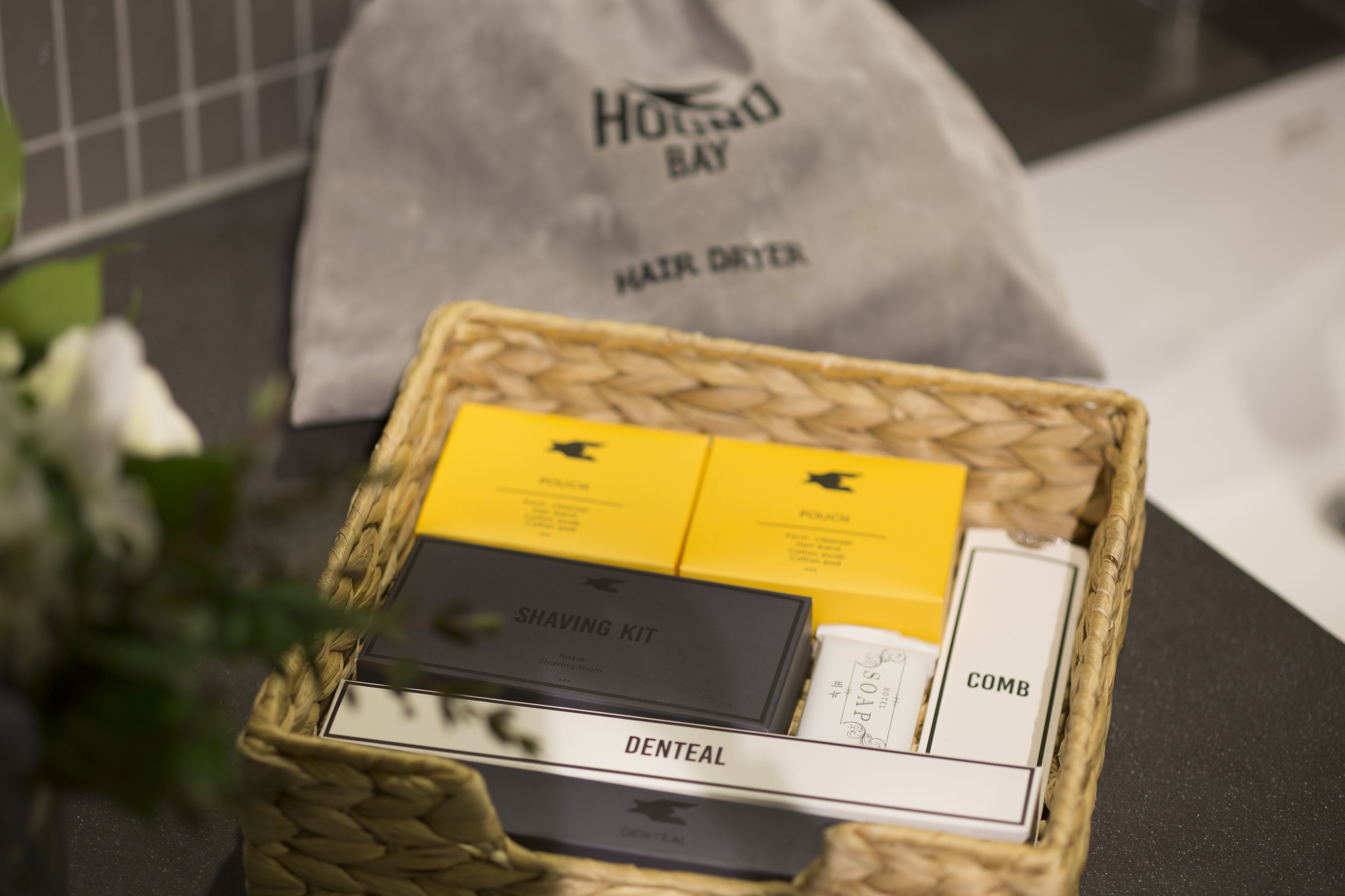 designer toiletries, hair dryer, bathrobes, slippers