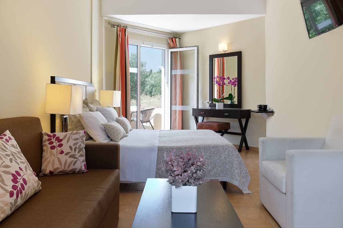 superior room, garden view | in-room safe, desk, soundproofing, iron/ironing board