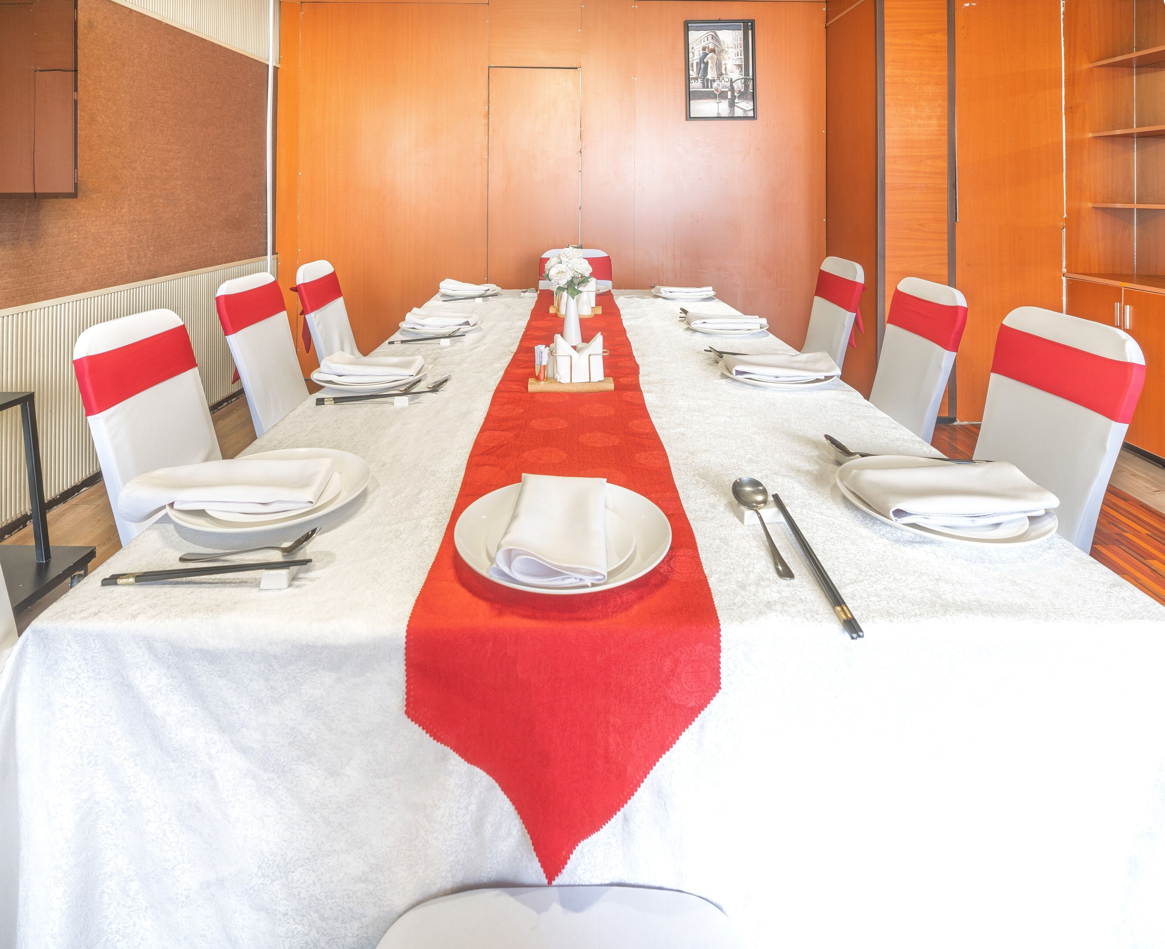 A conference room with a long table set for a meeting.