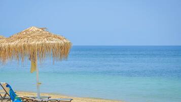 On the beach, sun-loungers, beach umbrellas