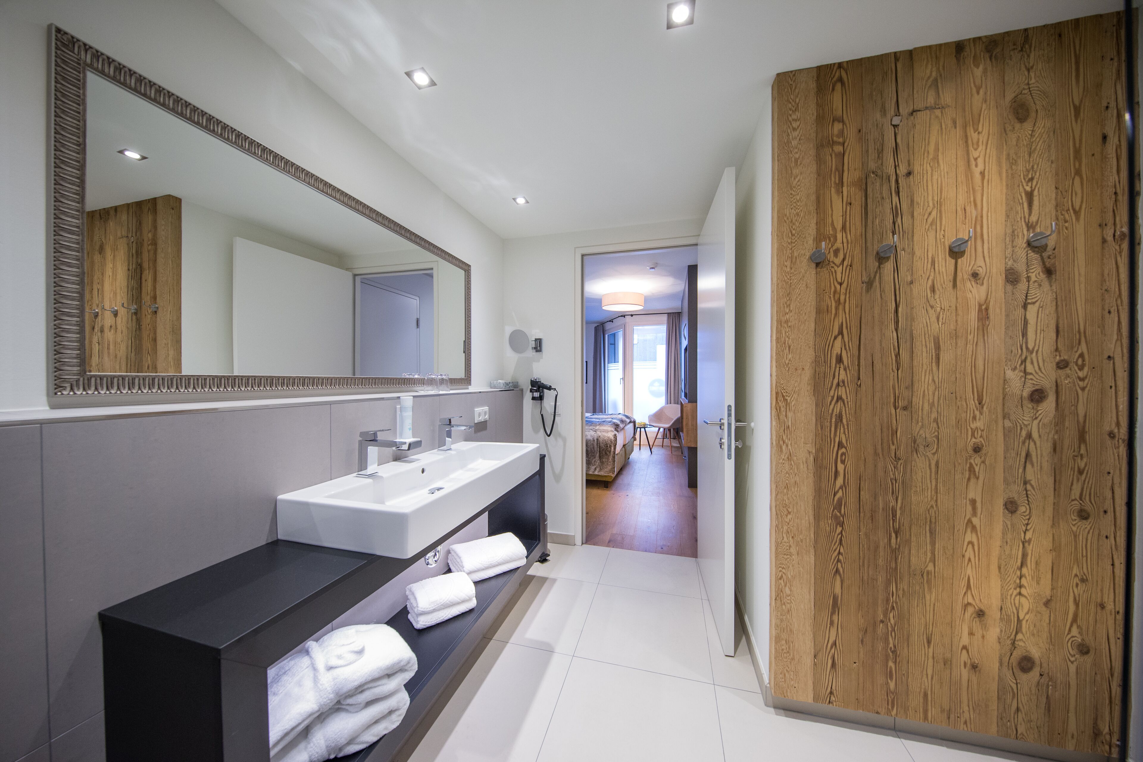 hair dryer, bathrobes, slippers, heated floors