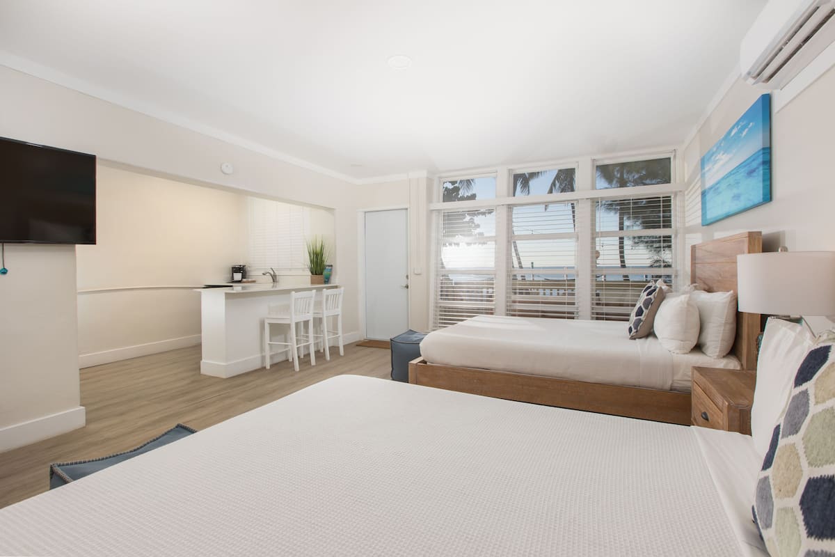 superior suite, 2 queen beds, kitchenette, bay view | iron/ironing board, free wifi, bed sheets