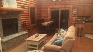 Living room | Flat-screen TV, fireplace - Our Cabin (Scottsville)