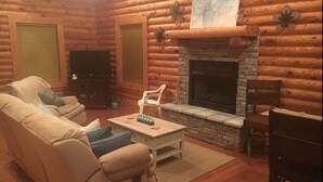 Living room | Flat-screen TV, fireplace - Our Cabin (Scottsville)