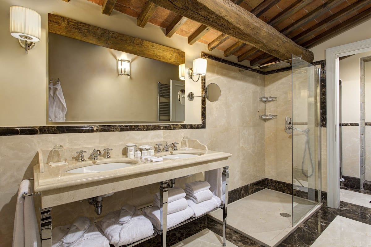 junior suite | bathroom | shower, rainfall showerhead, designer toiletries, hair dryer