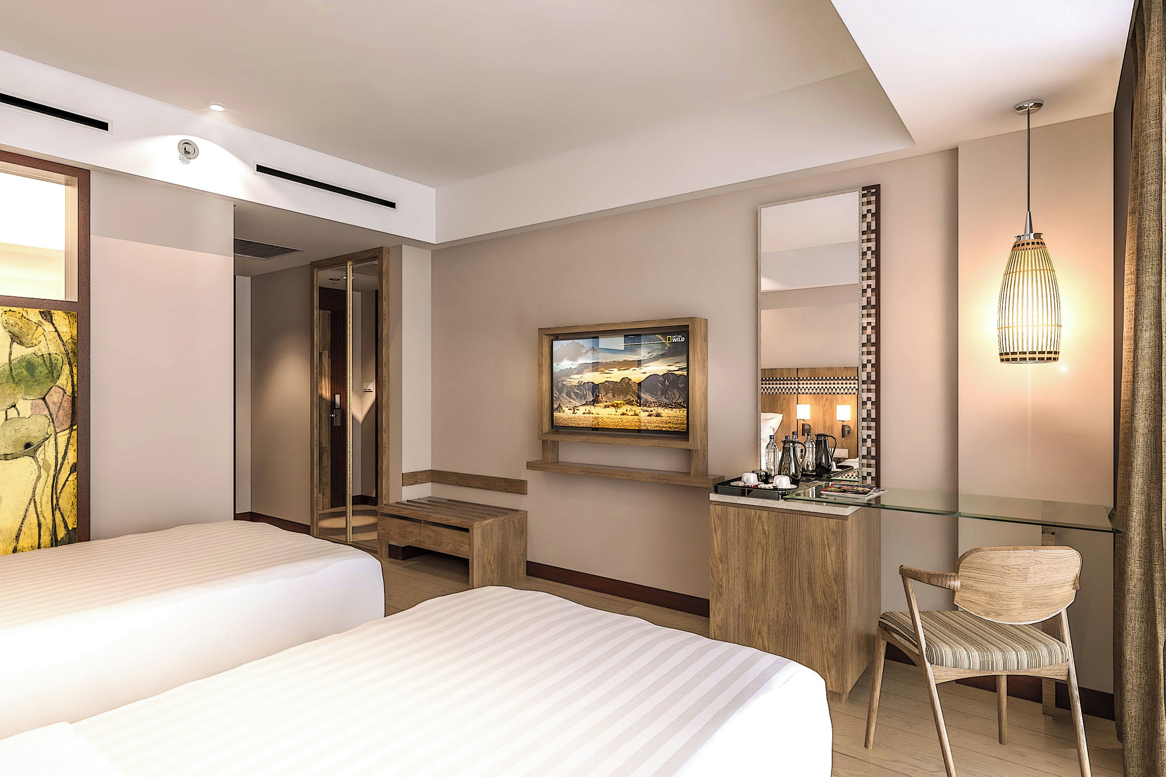 A hotel room with two beds, a desk with a mirror, a painting on the wall, and a hanging light fixture.
