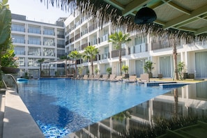 Outdoor pool, open 8:00 AM to 8:00 PM, free cabanas, pool umbrellas