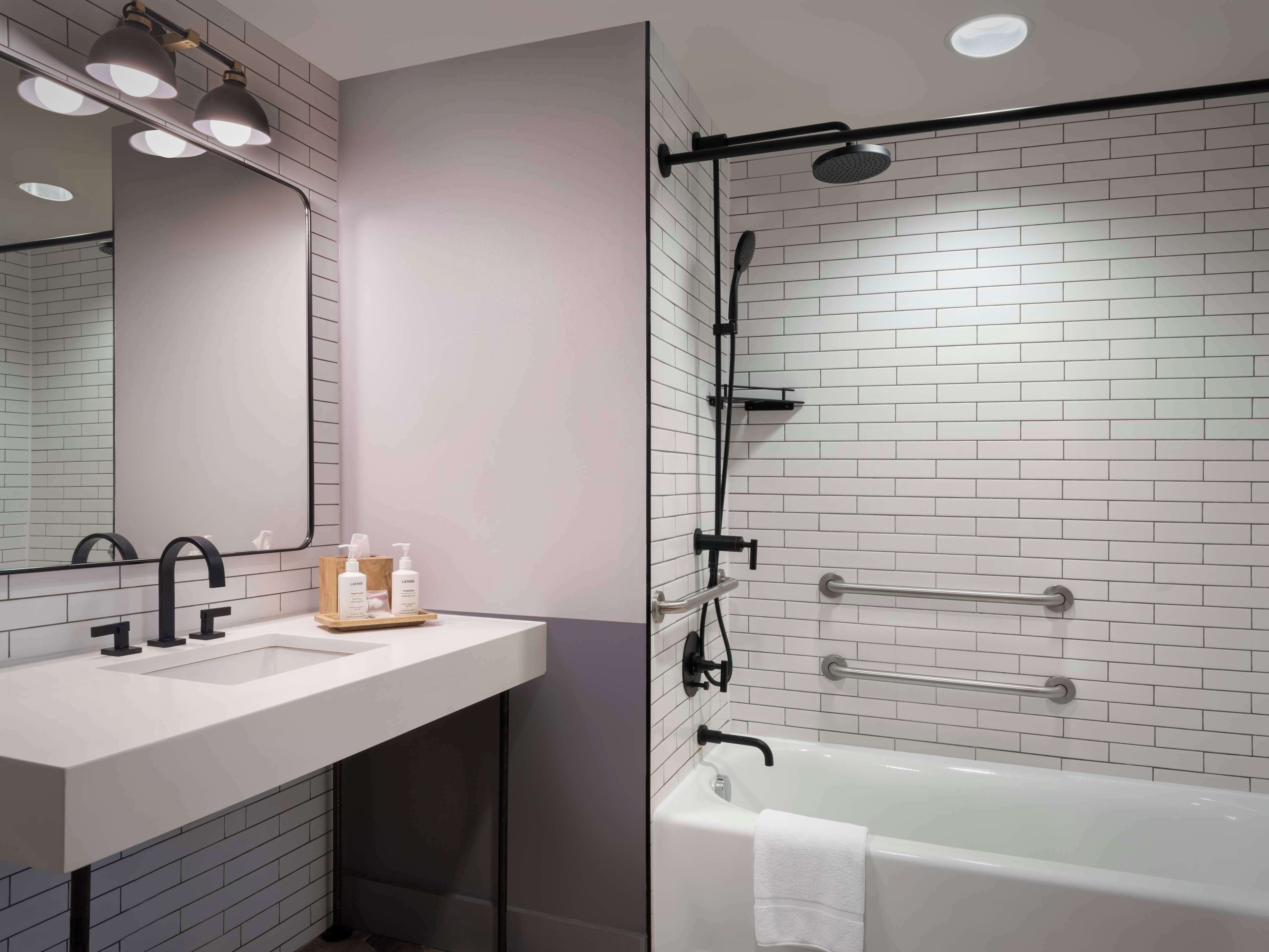 deep-soaking bathtub, rainfall showerhead, designer toiletries