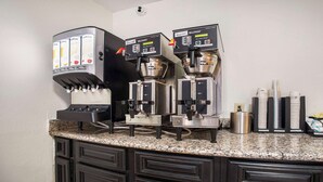 A coffee station with two Bunn espresso machines, a decaf option, and a regular option. - SureStay Plus Hotel by Best Western Sacramento North (Sacramento)