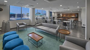 A modern lounge area with a sofa, chairs, and a coffee table. - Hotel Best Place Express (Zamora)